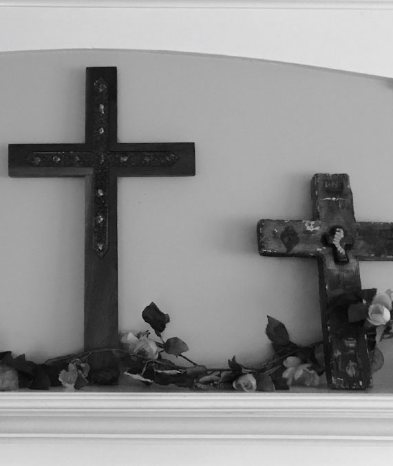 Crosses leaning against wall